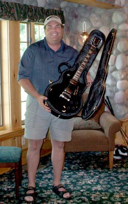 Mike Hill with Gibson guitar signed by Brian Wilson